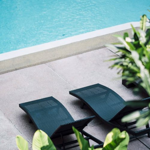 deckchair at swimming pool deckchair at swimming pool